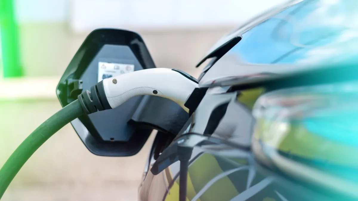 Charging cable plugged into the charge port of an electric car